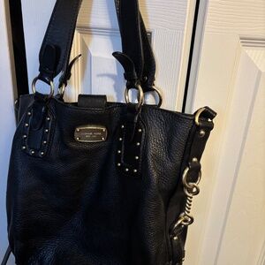 Tote handbag with attached crossbody strap.